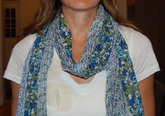Scarf looped around a model's neck